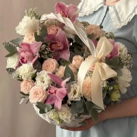 Basket with orchids in a delicate color scheme "About kindness"